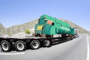 Transporte de carga especializada de y Hacia E.U.A. y CANADA. Modalidad: plataforma, lowboy y semi lowboy